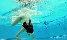 Katy Soroka's poolside nude swim in red bikini bottoms